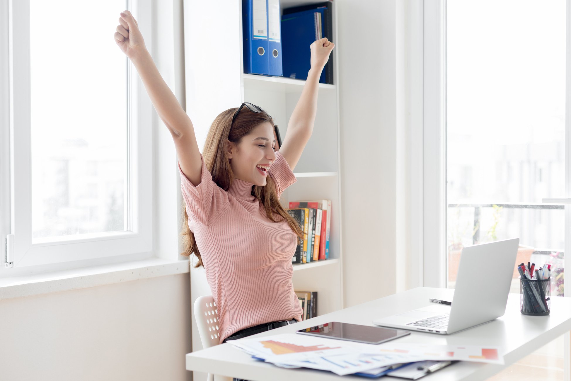 Happy excited woman at work